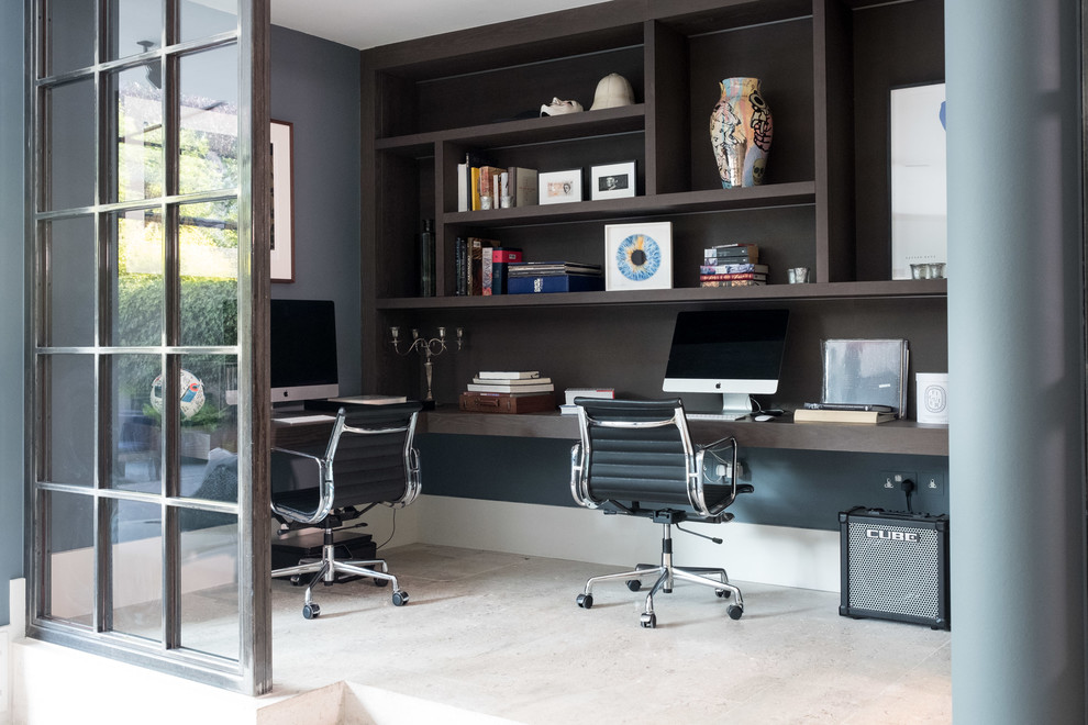 Photo of a small contemporary study room in London with grey walls, a built-in desk and beige floor.