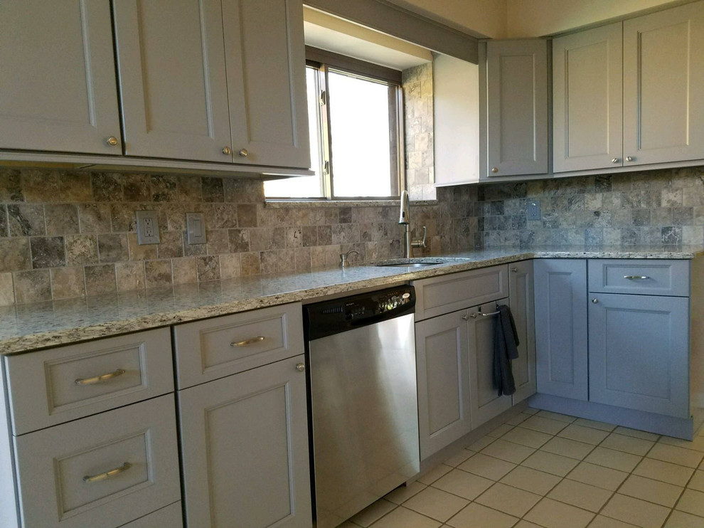 Example of a transitional kitchen design in New York