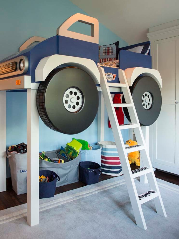 This is an example of a small country kids' room in San Francisco with blue walls and dark hardwood floors.