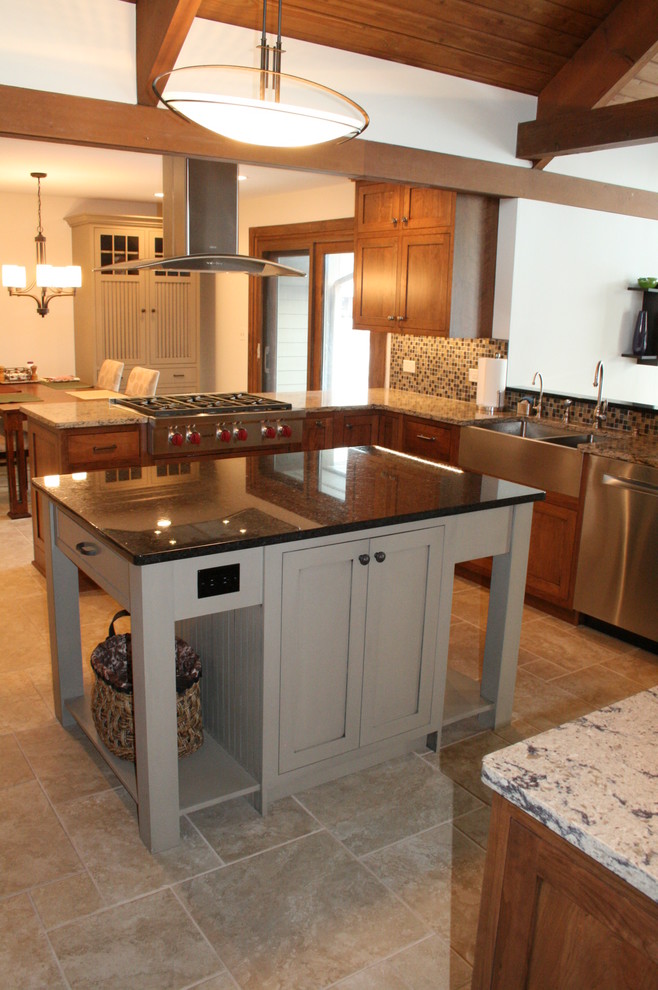 Eat-in kitchen - large transitional u-shaped ceramic tile eat-in kitchen idea in Chicago with a farmhouse sink, shaker cabinets, medium tone wood cabinets, granite countertops, multicolored backsplash, mosaic tile backsplash, stainless steel appliances and an island