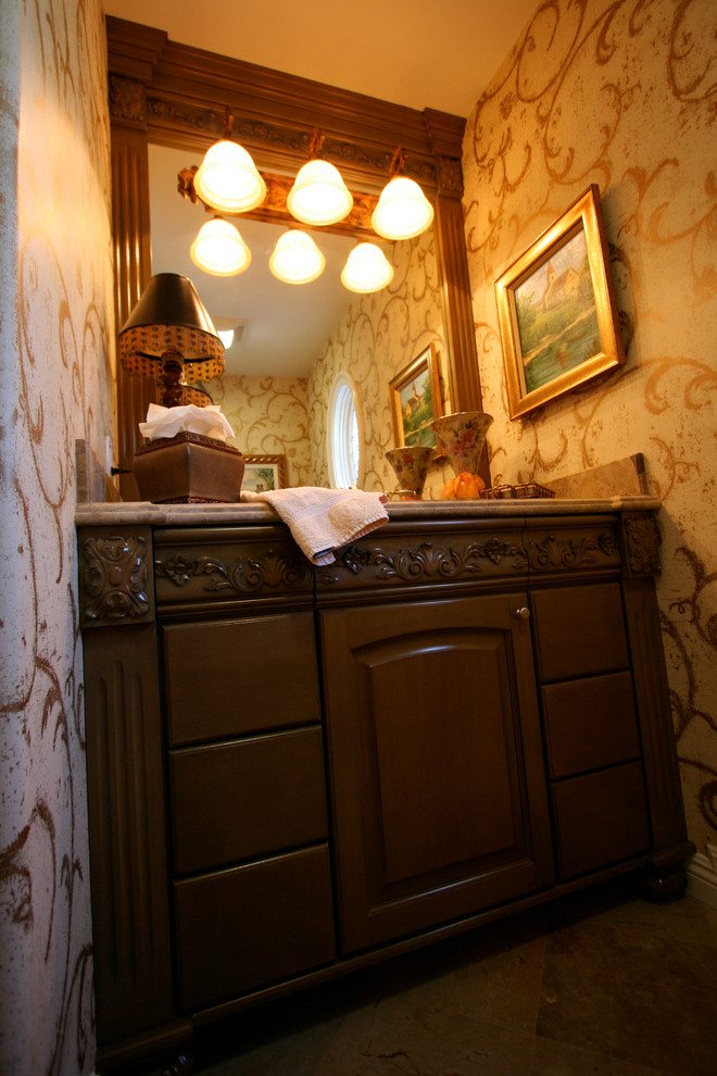 This is an example of a traditional powder room in Orange County.