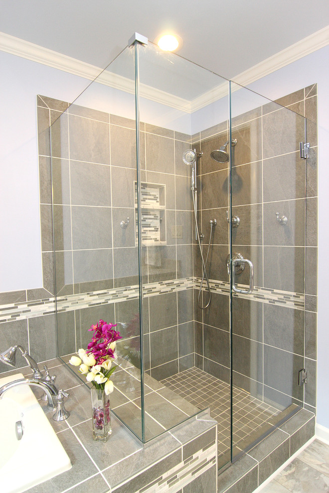 Inspiration for a mid-sized transitional master gray tile and porcelain tile linoleum floor drop-in bathtub remodel with an undermount sink, raised-panel cabinets, white cabinets, marble countertops, a two-piece toilet and purple walls