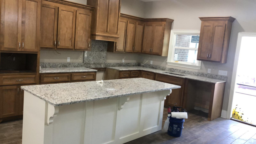 Kitchen - kitchen idea with granite backsplash and multicolored countertops