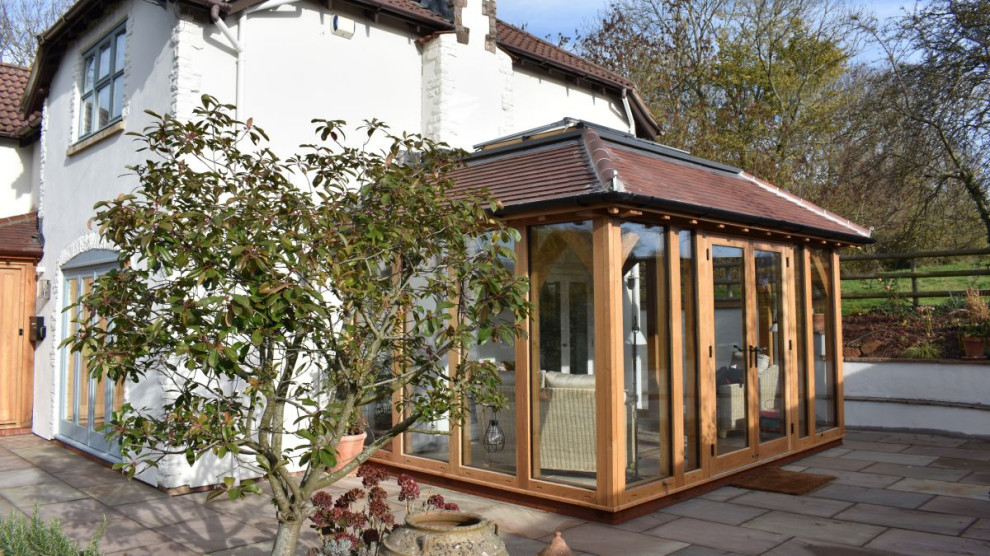 This is an example of a farmhouse conservatory in Other.