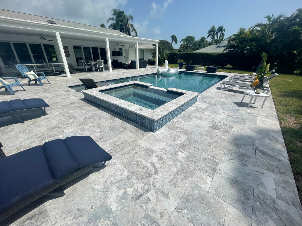 Inspiration for a transitional backyard pool landscaping remodel in Miami with decking