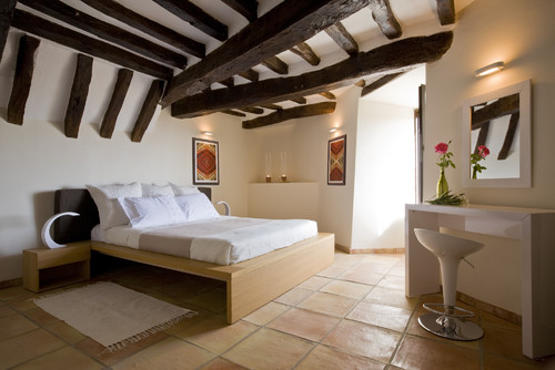 terracotta floor bedroom with exposed beams