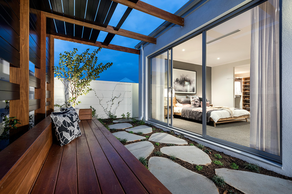 Contemporary courtyard patio in Perth with concrete pavers and a pergola.