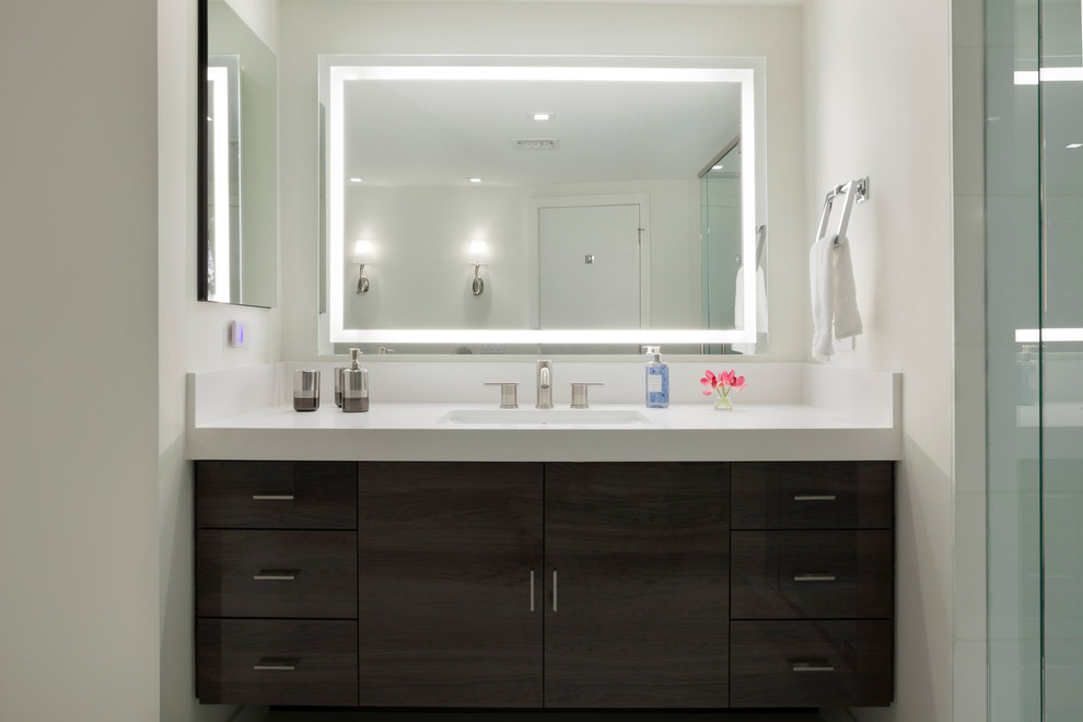 Design ideas for a contemporary master bathroom in Miami with an undermount sink, flat-panel cabinets, dark wood cabinets, engineered quartz benchtops, a freestanding tub, a corner shower, white tile, glass tile, white walls and ceramic floors.