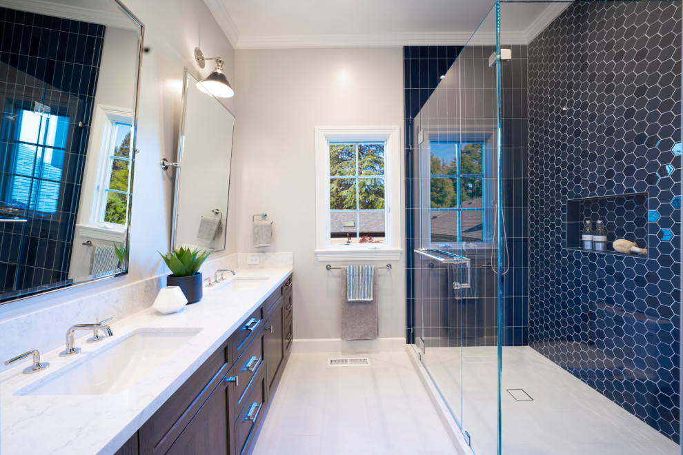 Transitional kids' blue tile and porcelain tile marble floor, white floor and double-sink corner shower photo in San Francisco with shaker cabinets, dark wood cabinets, gray walls, an undermount sink, quartz countertops, a hinged shower door, white countertops and a built-in vanity