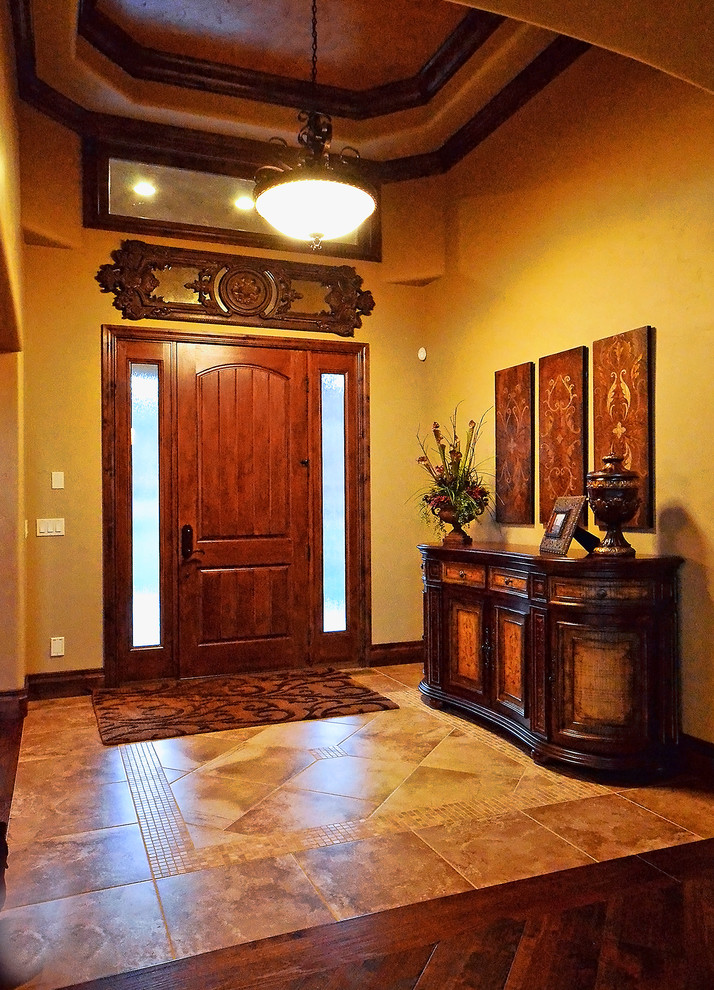 Example of a transitional home design design in Denver