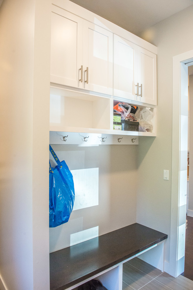 Example of a huge ceramic tile and multicolored floor mudroom design