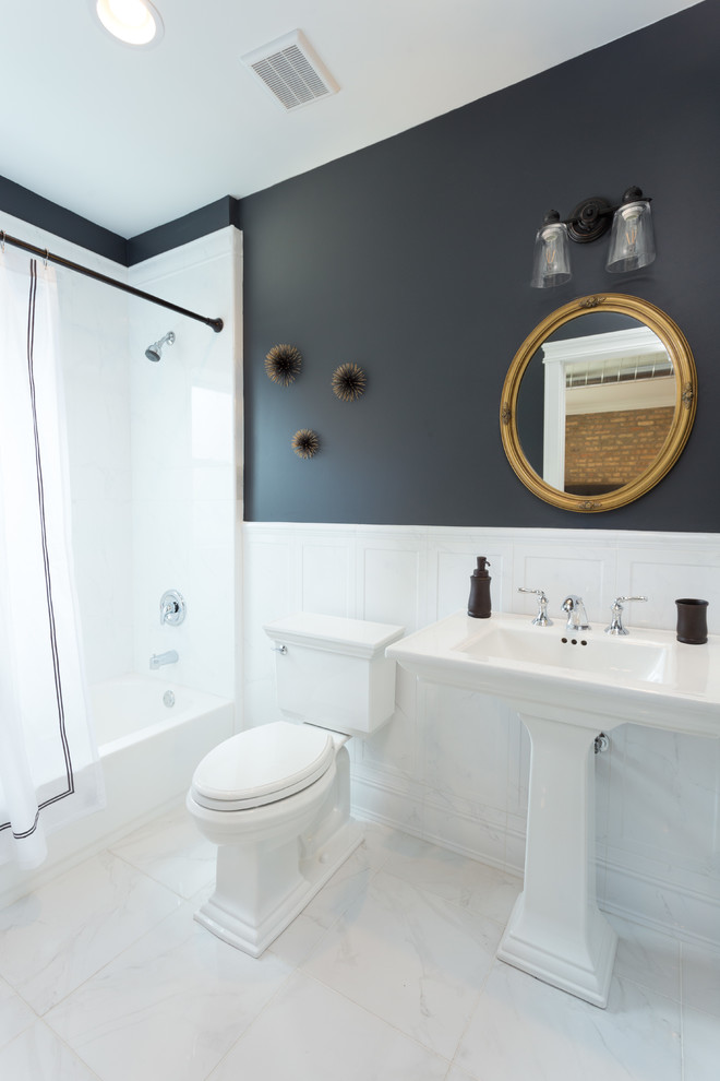 Inspiration for a mid-sized industrial 3/4 bathroom in Chicago with a corner tub, a shower/bathtub combo, a two-piece toilet, white tile, marble, multi-coloured walls, mosaic tile floors, an undermount sink, white floor and a shower curtain.