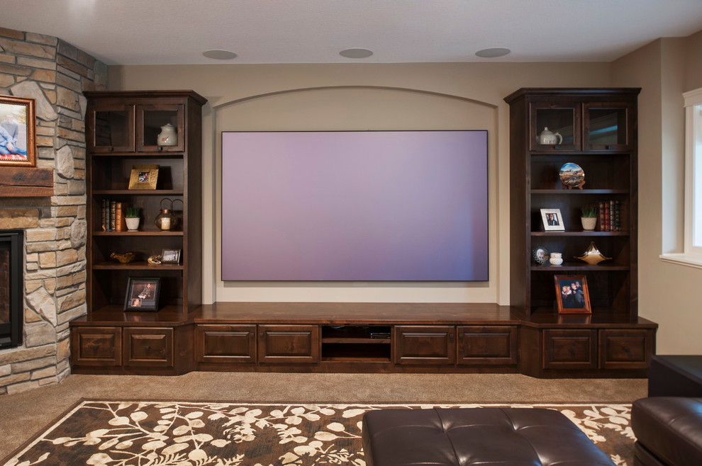 Large arts and crafts open concept home theatre in Minneapolis with brown walls, carpet, a projector screen and brown floor.