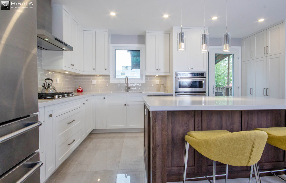 Example of a transitional kitchen design in Toronto
