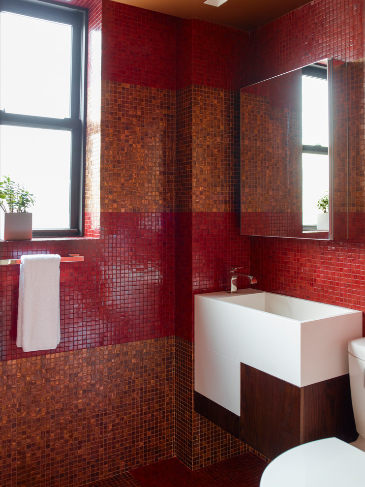 Inspiration for a contemporary bathroom in New York with a wall-mount sink, flat-panel cabinets, white cabinets, red tile, mosaic tile and red walls.