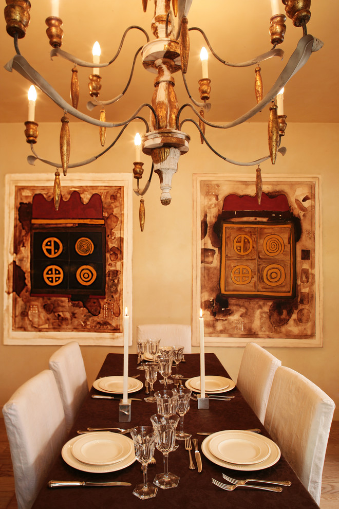 This is an example of an eclectic dining room in Rome with beige walls.