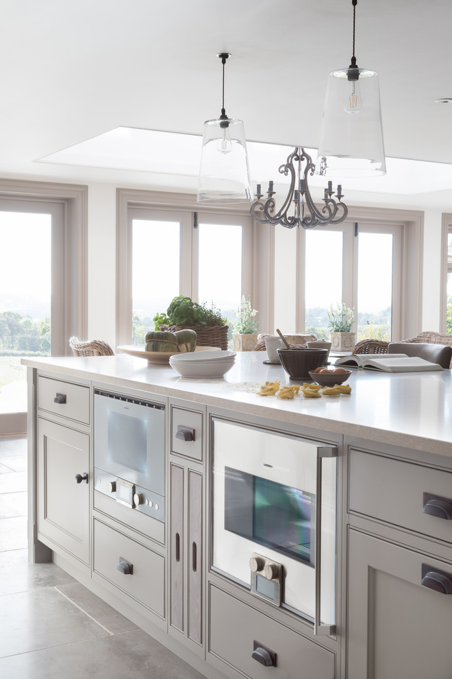 Photo of a large transitional kitchen in Sussex.