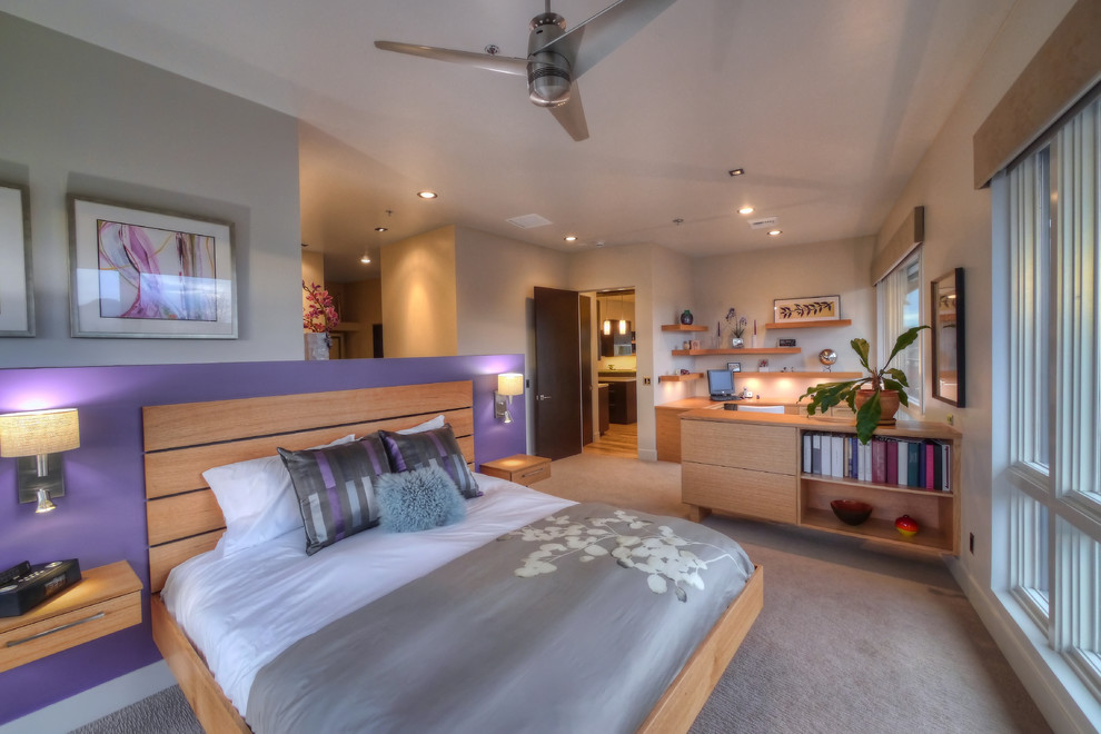 This is an example of a mid-sized modern master bedroom in Other with purple walls, carpet, no fireplace and grey floor.