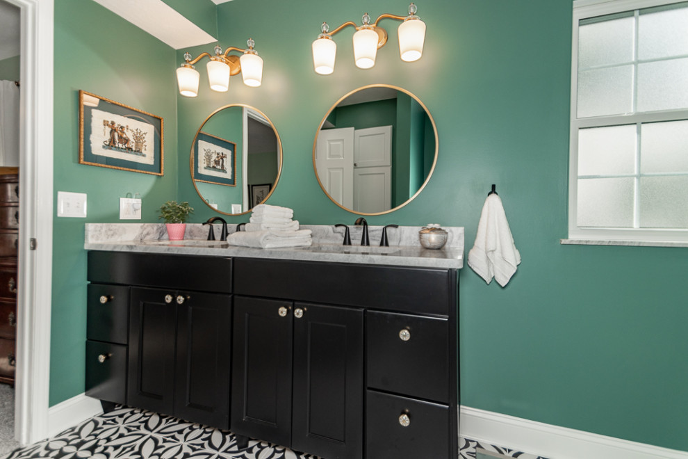 Photo of a transitional bathroom in Cleveland with shaker cabinets, black cabinets, a double shower, a one-piece toilet, white tile, porcelain tile, green walls, porcelain floors, an undermount sink, granite benchtops, white floor, a hinged shower door, white benchtops, a shower seat, a double vanity and a floating vanity.