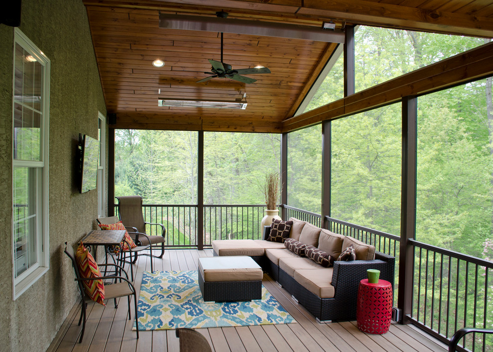 Inspiration for a large country backyard screened-in verandah in Philadelphia with a roof extension.
