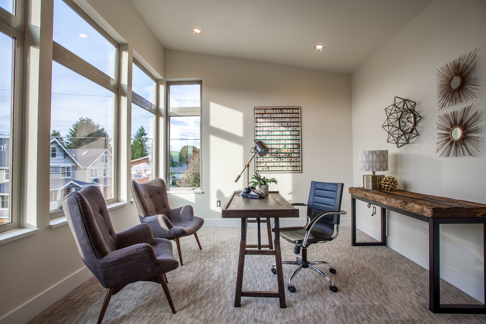 This is an example of a transitional study room in Portland with carpet, no fireplace and a freestanding desk.