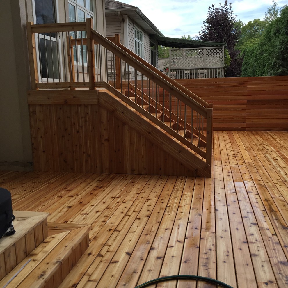 Photo of an arts and crafts backyard deck in Ottawa with no cover.