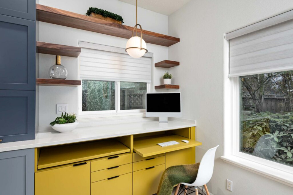 Transitional galley vinyl floor and gray floor kitchen photo with an undermount sink, shaker cabinets, blue cabinets, quartz countertops, multicolored backsplash, ceramic backsplash, stainless steel appliances, a peninsula and white countertops