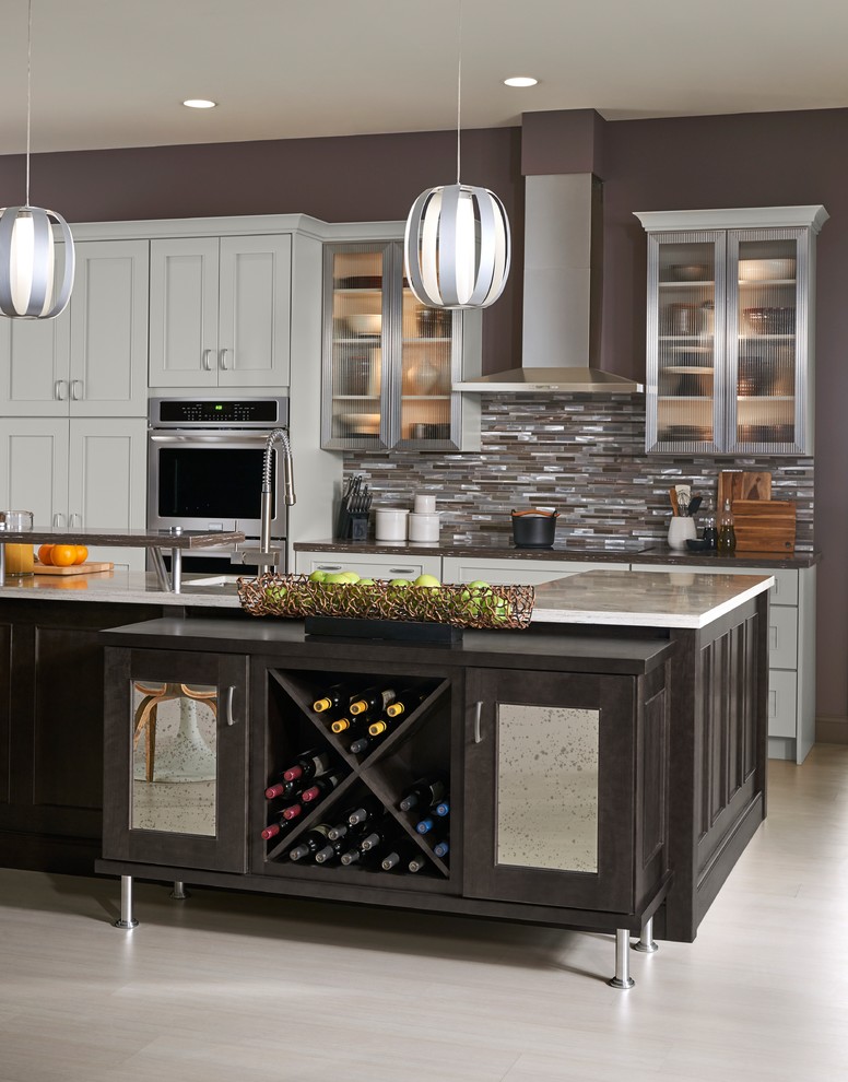 Inspiration for a large transitional l-shaped eat-in kitchen remodel with shaker cabinets, white cabinets and an island