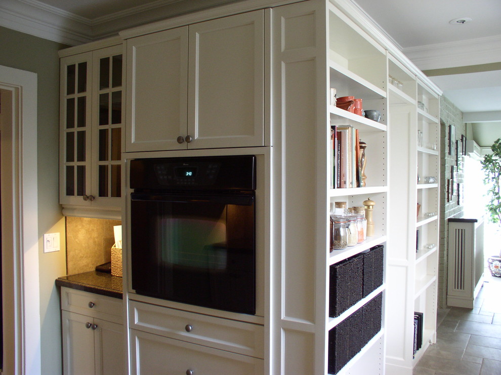 Example of a transitional kitchen design in Toronto