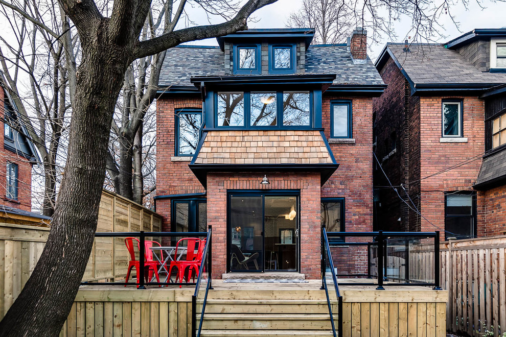 Photo of a traditional three-storey exterior in Toronto.