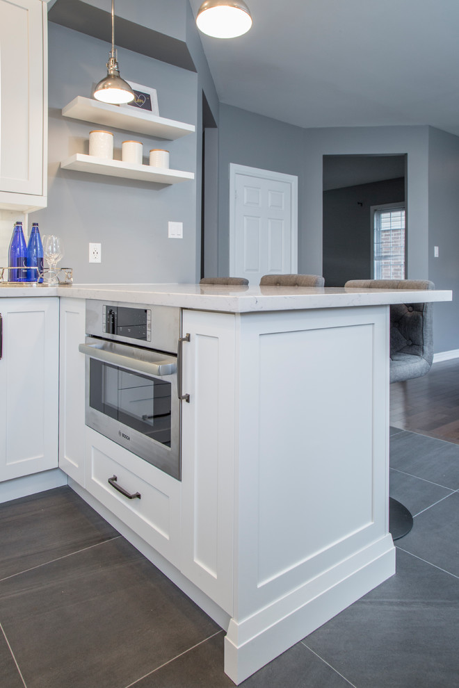 Example of a transitional kitchen design in Toronto