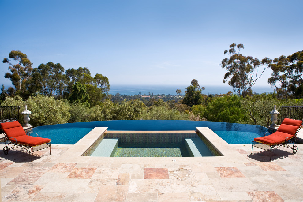 Photo of a mediterranean backyard custom-shaped infinity pool in New York with a hot tub and tile.