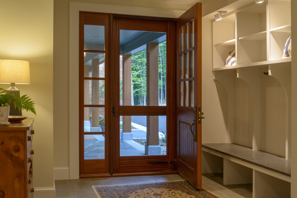 Design ideas for a small transitional mudroom in Boston with beige walls, ceramic floors, a single front door, a red front door and brown floor.