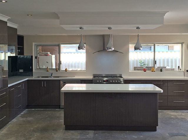 Photo of a mid-sized contemporary l-shaped open plan kitchen in Perth with flat-panel cabinets, dark wood cabinets, granite benchtops, stainless steel appliances, with island, a double-bowl sink, black splashback and glass sheet splashback.