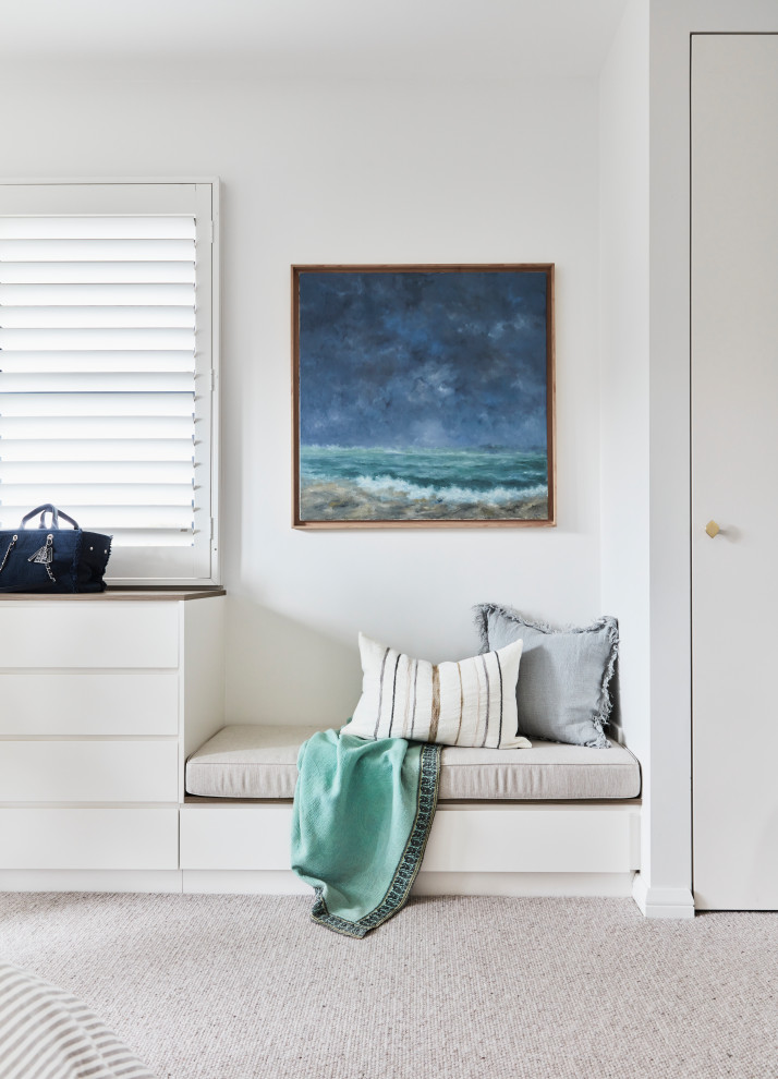Inspiration for a mid-sized beach style master bedroom in Sydney with white walls, carpet and grey floor.