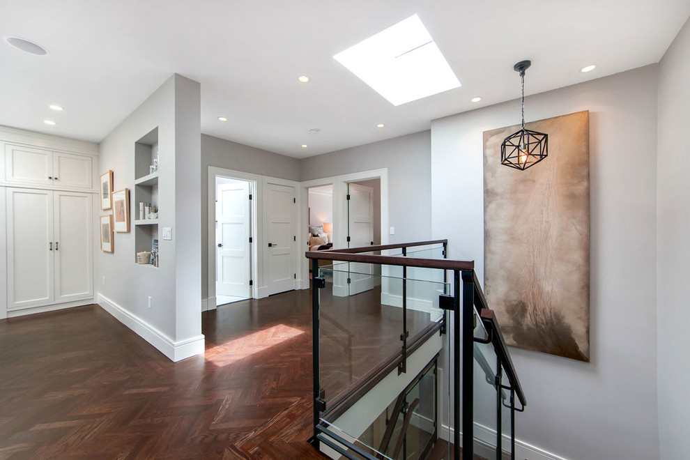 Large contemporary hallway in San Francisco with grey walls and dark hardwood floors.