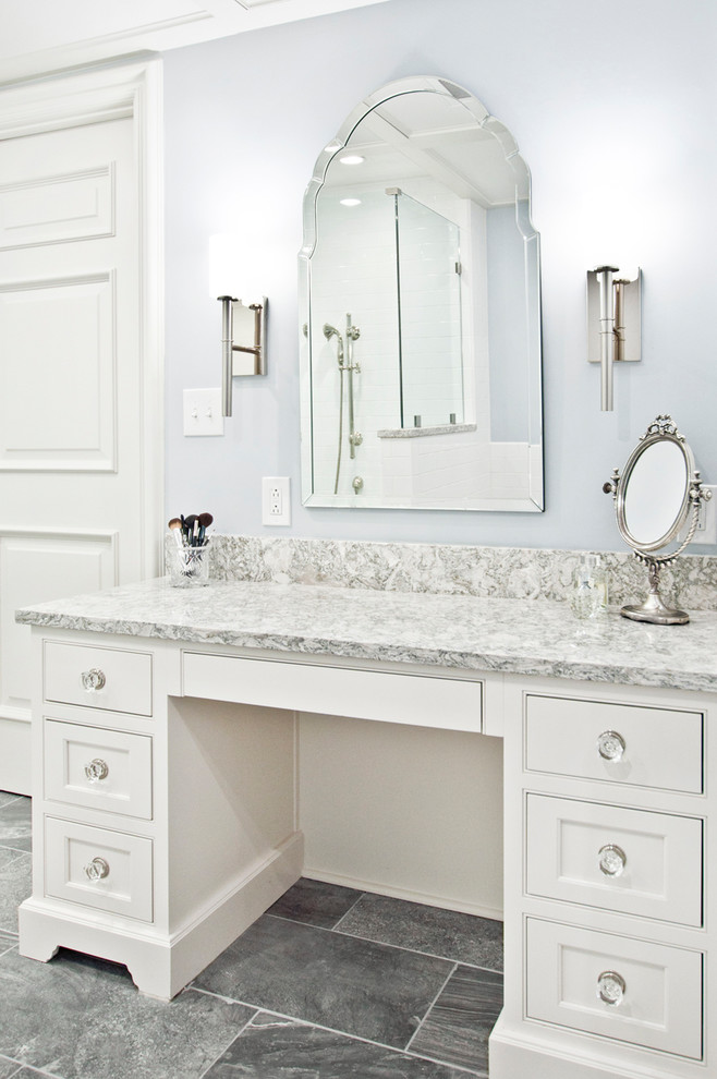 This is an example of a mid-sized traditional master bathroom in Nashville with flat-panel cabinets, white cabinets, a claw-foot tub, white tile, subway tile, blue walls, porcelain floors, an undermount sink, engineered quartz benchtops, grey floor, a hinged shower door, an alcove shower and multi-coloured benchtops.