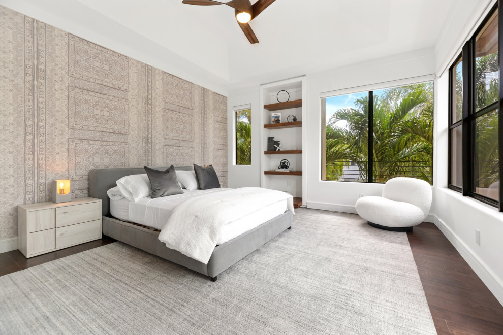 Photo of a contemporary guest bedroom in Miami with white walls, dark hardwood flooring, brown floors and wallpapered walls.