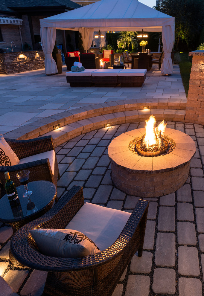 Design ideas for a large contemporary backyard patio in Boston with a fire feature, stamped concrete and a gazebo/cabana.