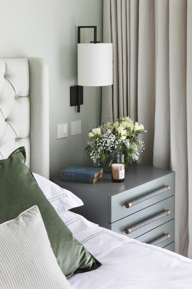 Design ideas for a contemporary master bedroom in London with grey walls and carpet.