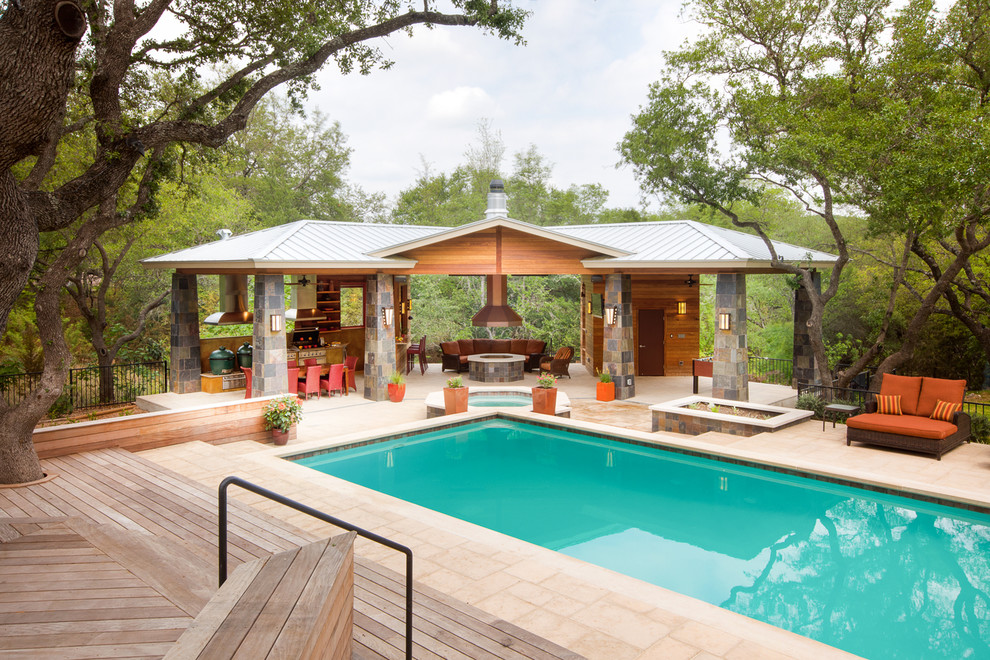Contemporary pool in Austin with decking.
