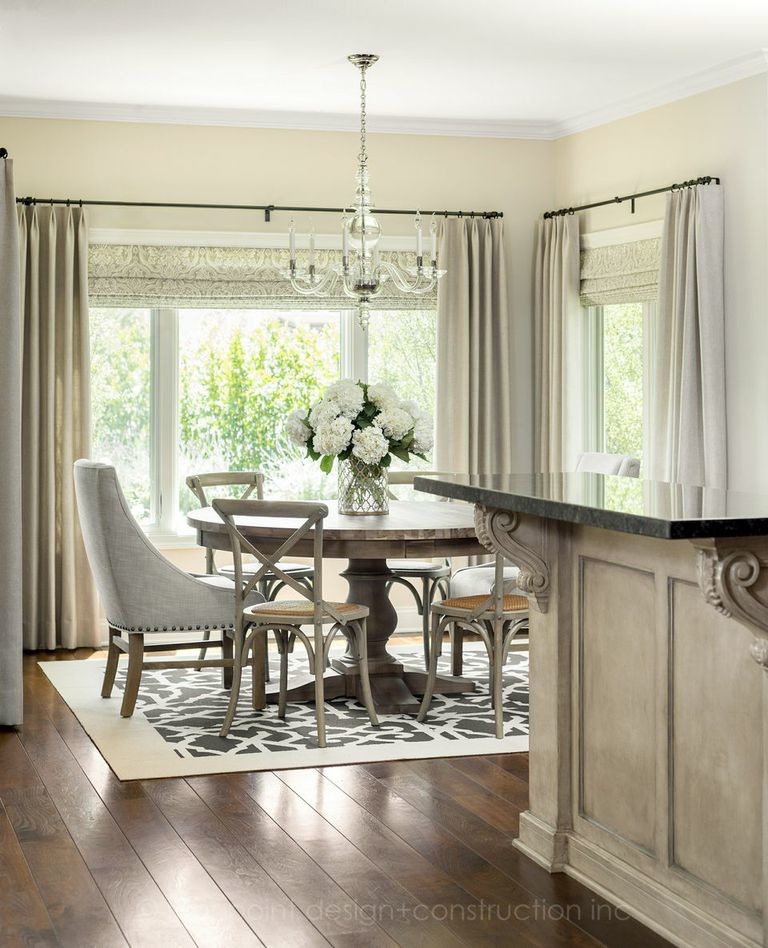 Photo of a mid-sized transitional open plan dining in Los Angeles with beige walls and medium hardwood floors.