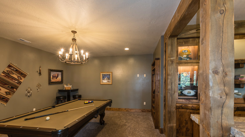 Inspiration for a large rustic look-out carpeted and beige floor basement remodel with brown walls