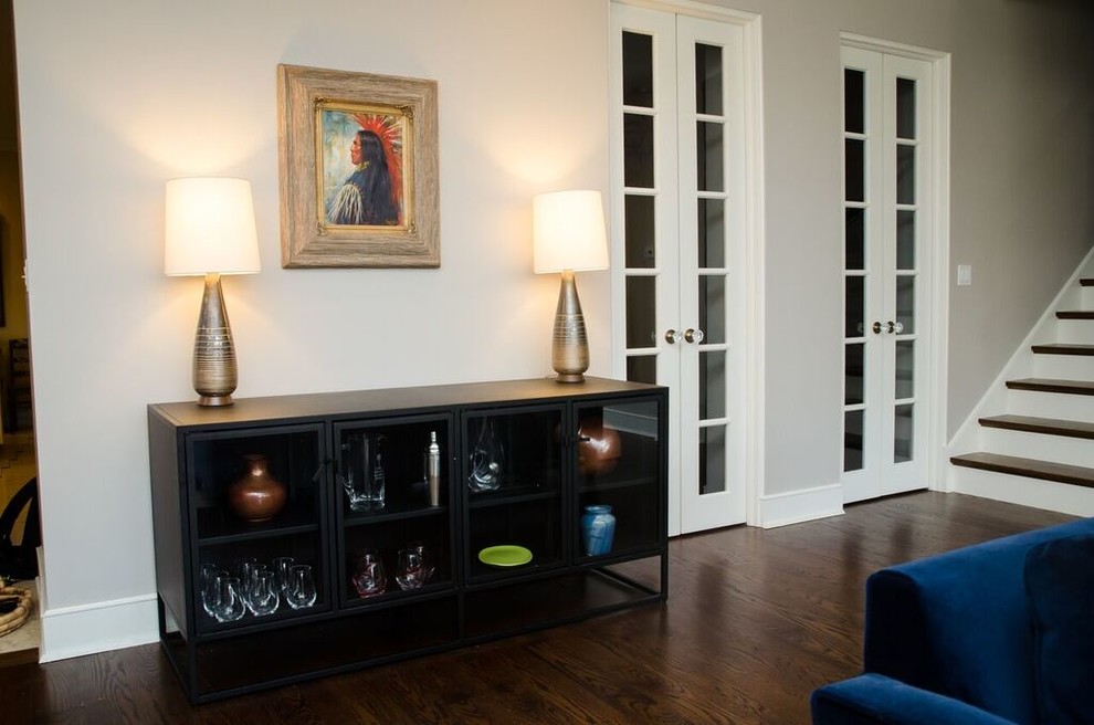 Large transitional dark wood floor hallway photo in Chicago with gray walls