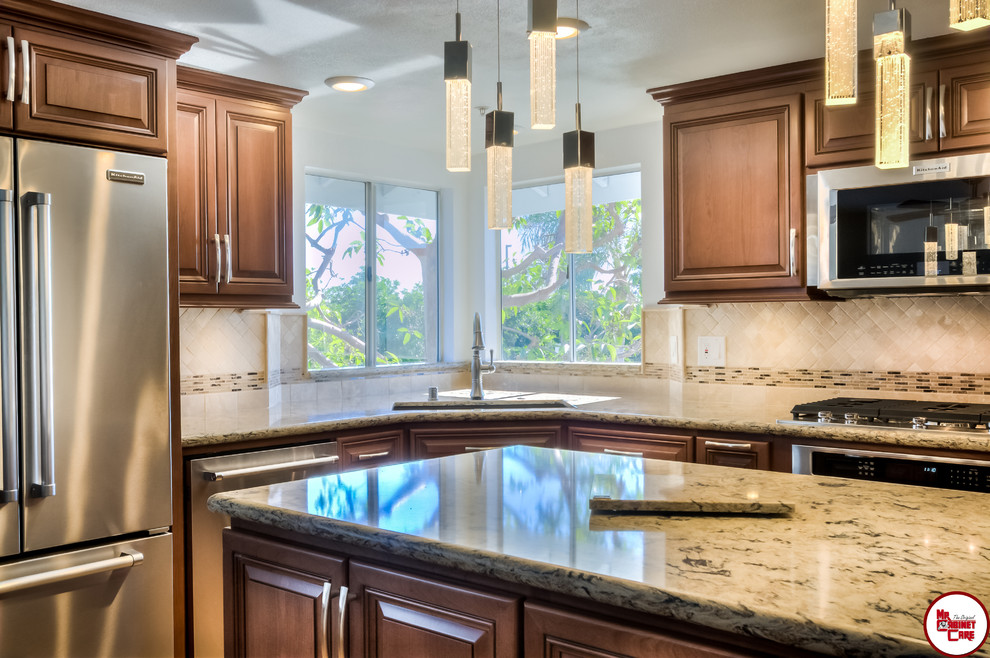 Design ideas for a mid-sized transitional l-shaped separate kitchen in Orange County with an undermount sink, raised-panel cabinets, medium wood cabinets, quartz benchtops, multi-coloured splashback, stainless steel appliances, light hardwood floors and with island.