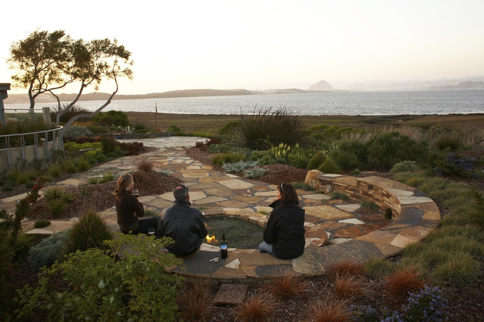 Inspiration for a beach style garden in San Luis Obispo with a fire feature.