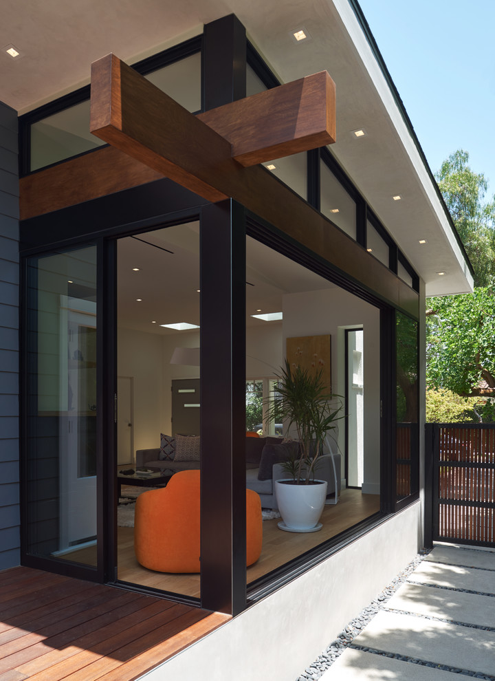 Inspiration for a mid-sized craftsman blue two-story wood gable roof remodel in Los Angeles with a shingle roof