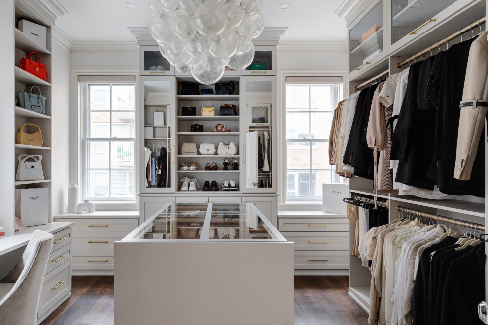 Inspiration for a large transitional women's dark wood floor and brown floor walk-in closet remodel in Boston with shaker cabinets and gray cabinets