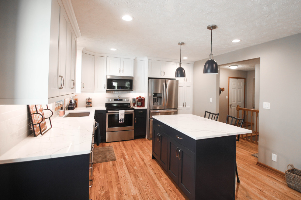 Example of a mid-sized transitional home design design