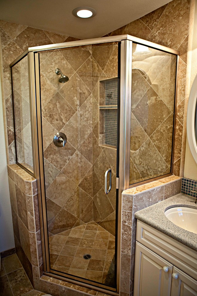 Inspiration for a mid-sized traditional master bathroom in Orange County with an undermount sink, raised-panel cabinets, white cabinets, engineered quartz benchtops, a drop-in tub, a corner shower, a two-piece toilet, beige tile, porcelain tile, beige walls and porcelain floors.